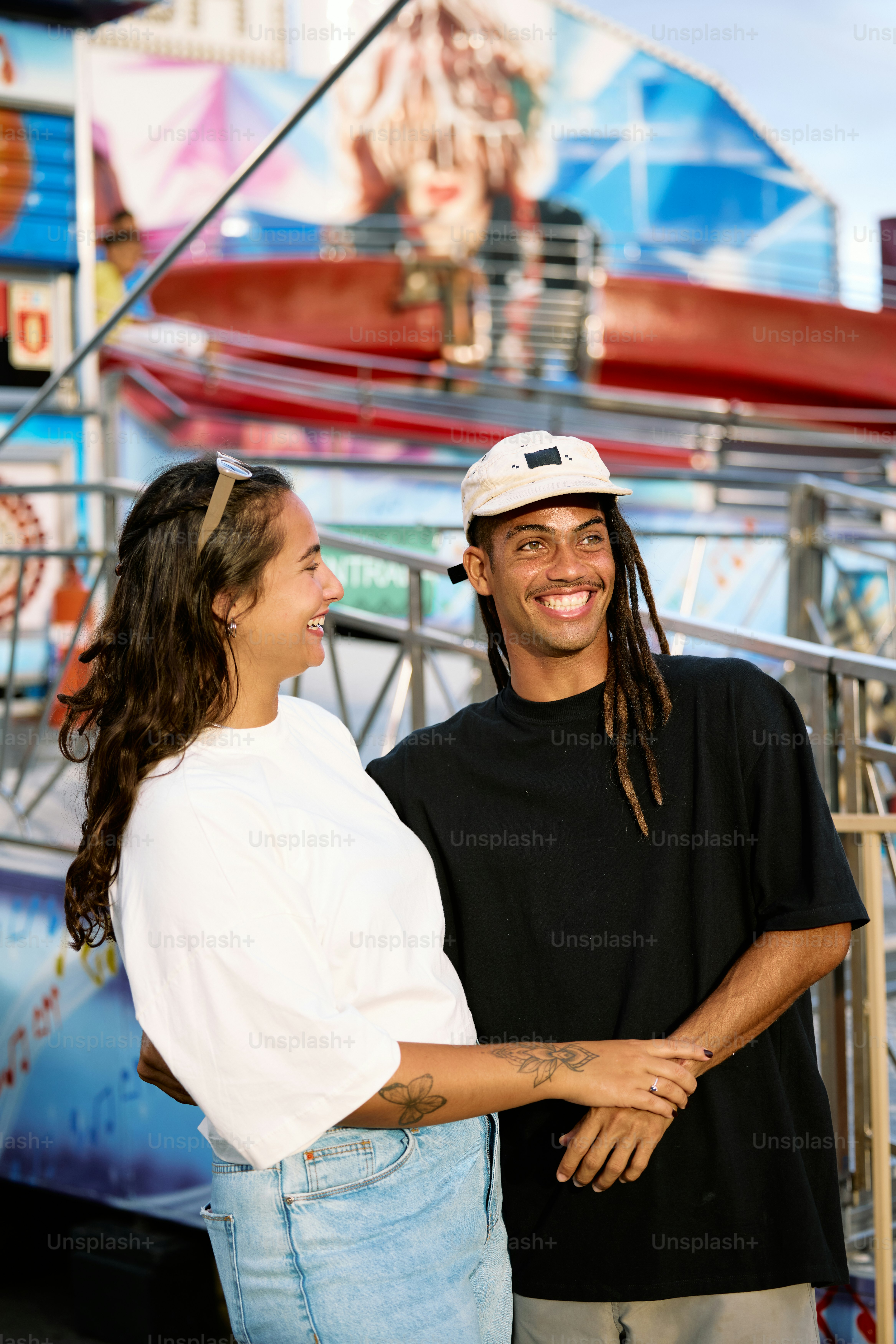 a man and a woman standing next to each other