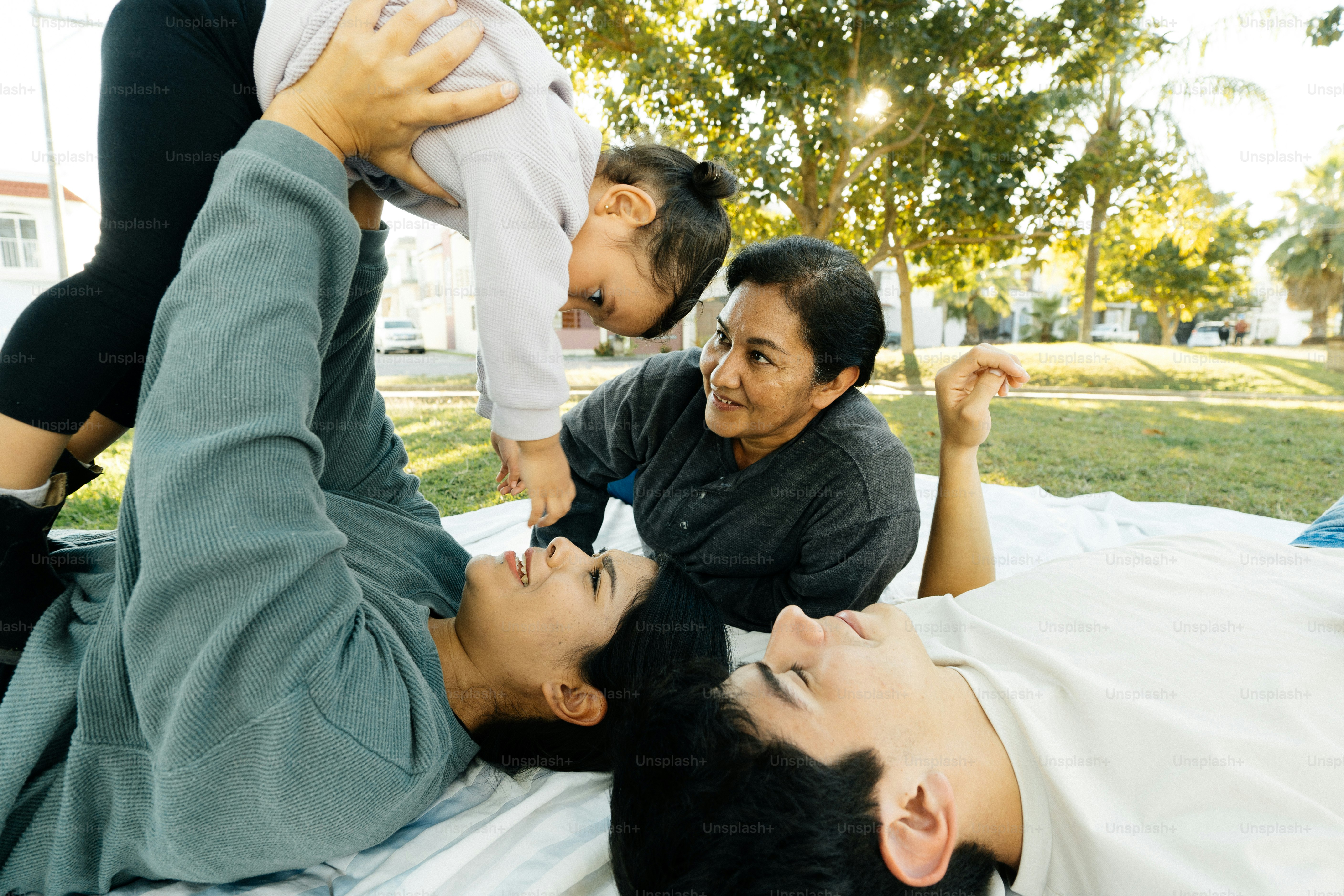a group of people laying on top of a bed