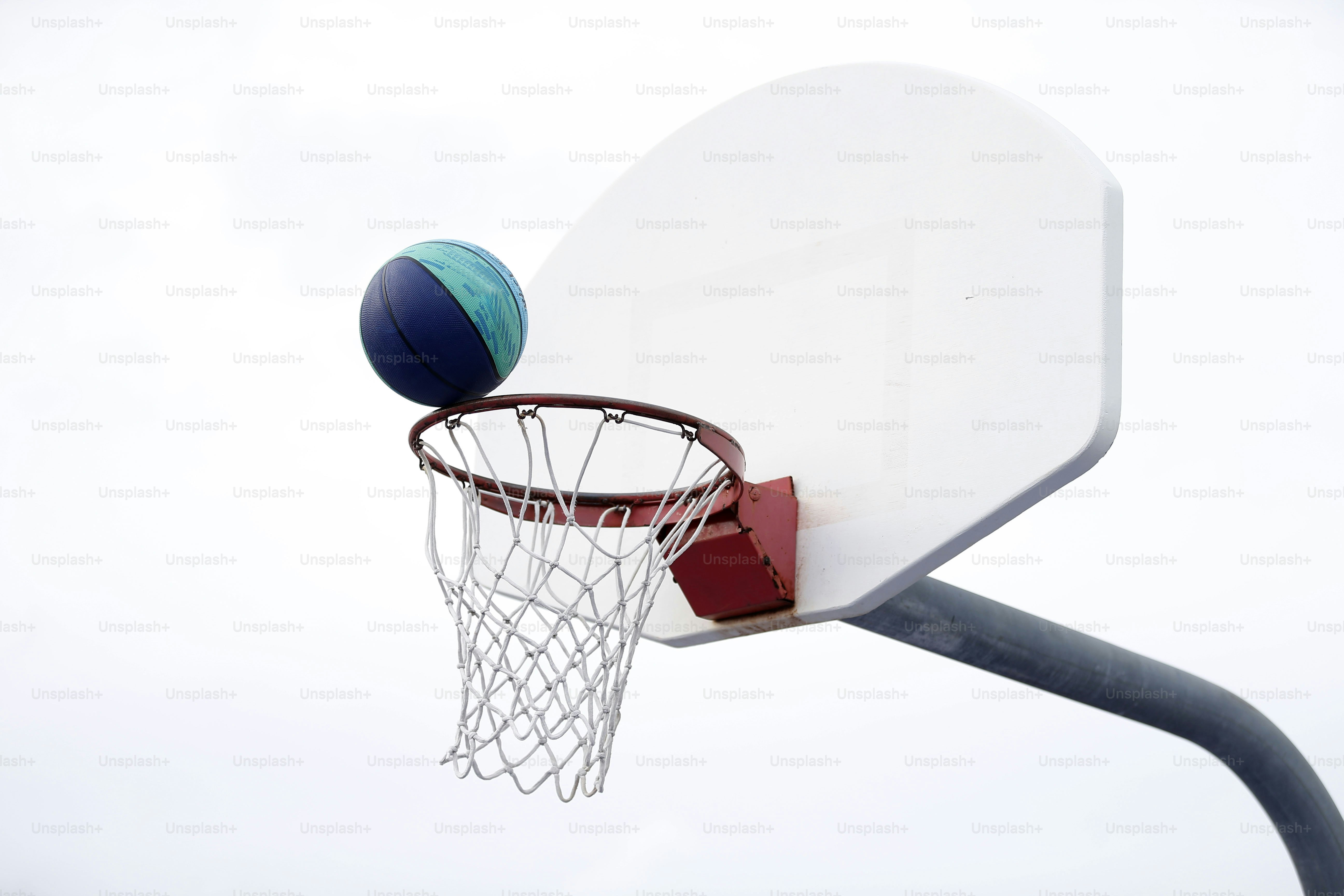 A basketball about to go into the hoop