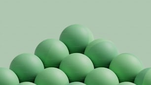 a pile of green eggs sitting on top of each other