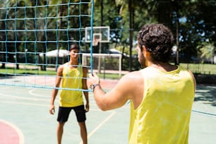 a man and a woman playing a game of volleyball
