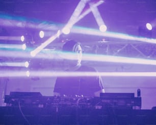 a man standing in front of a keyboard on a stage