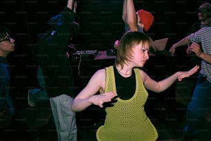 a group of people dancing in a dark room