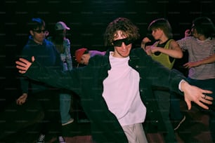 a group of people dancing in a dark room