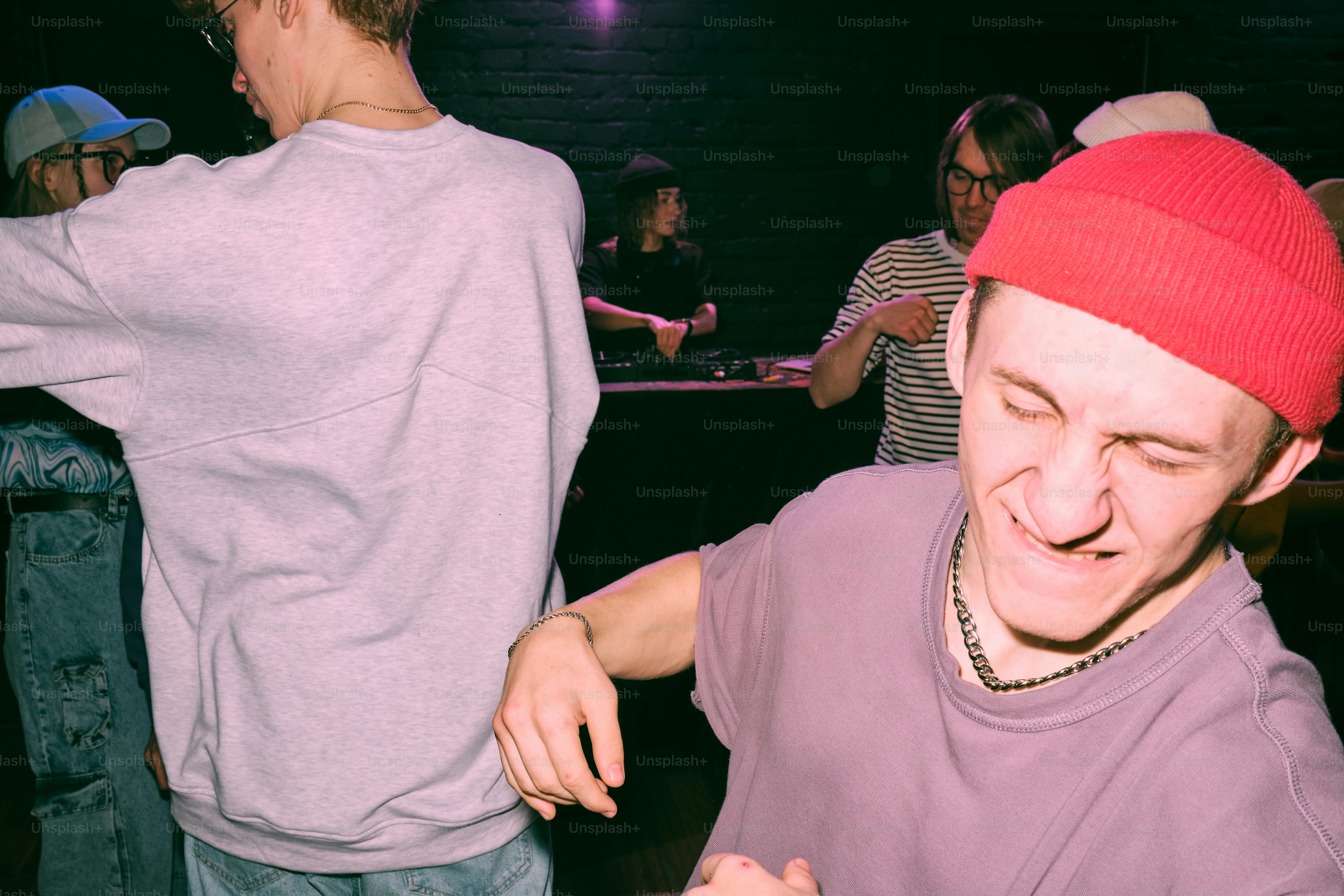 a man in a red hat is playing a video game