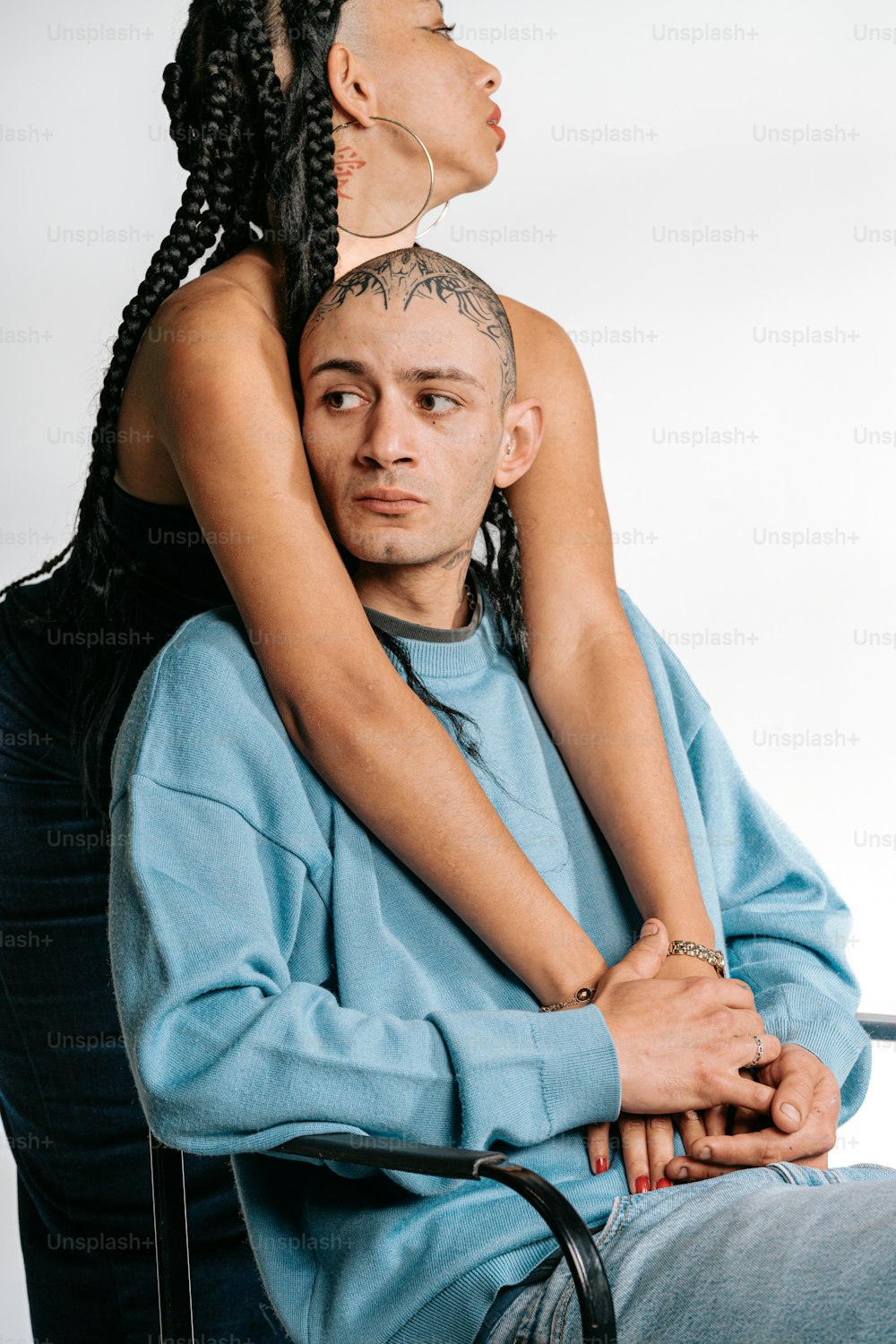 a woman sitting on top of a man's head