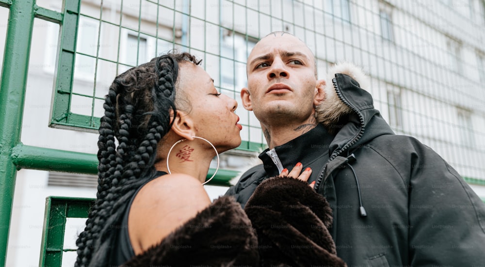 a man and a woman standing next to each other