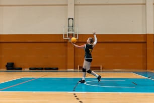 a person on a court with a ball