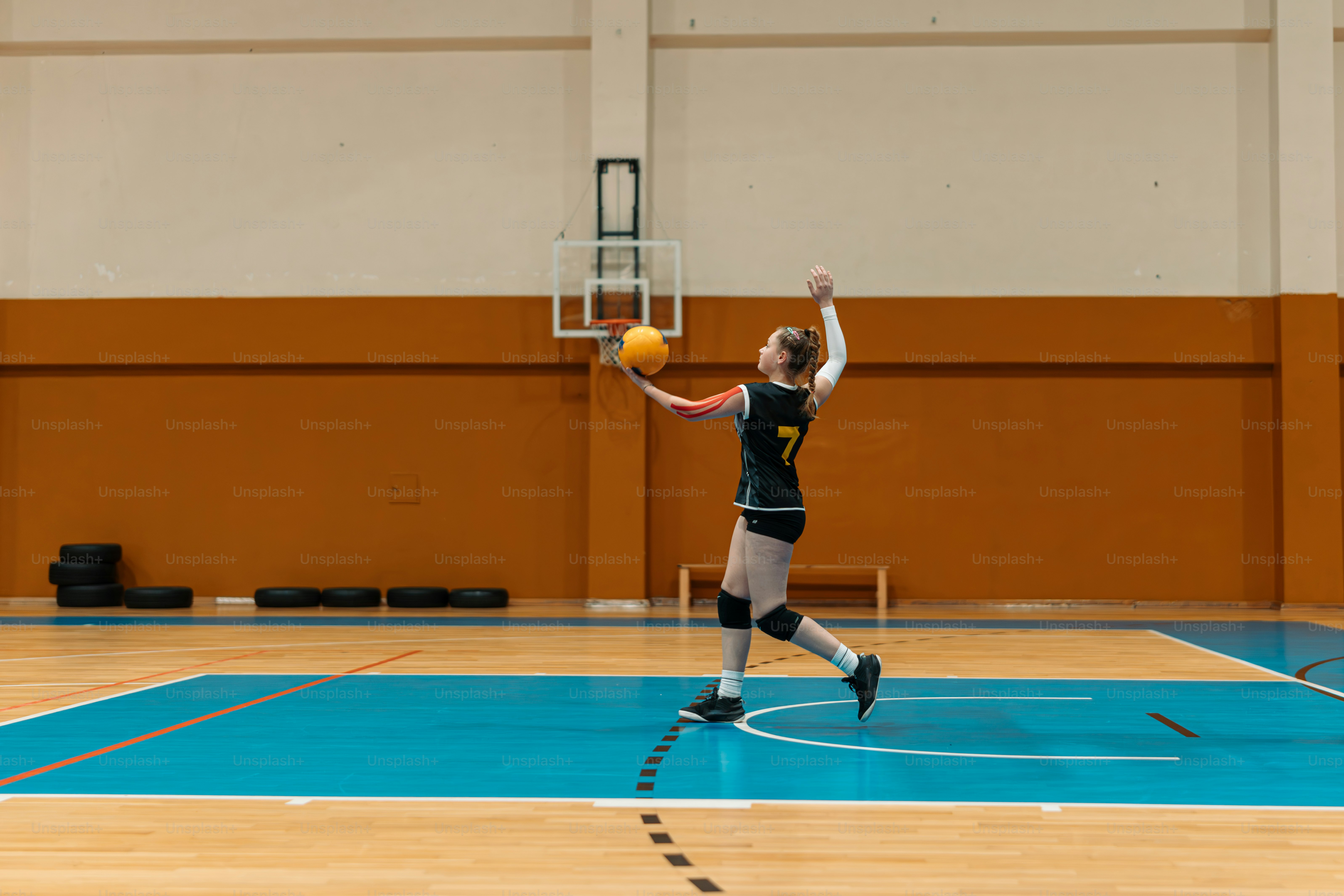 a person on a court with a ball