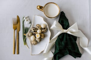 a plate of eggs and a cup of milk on a table