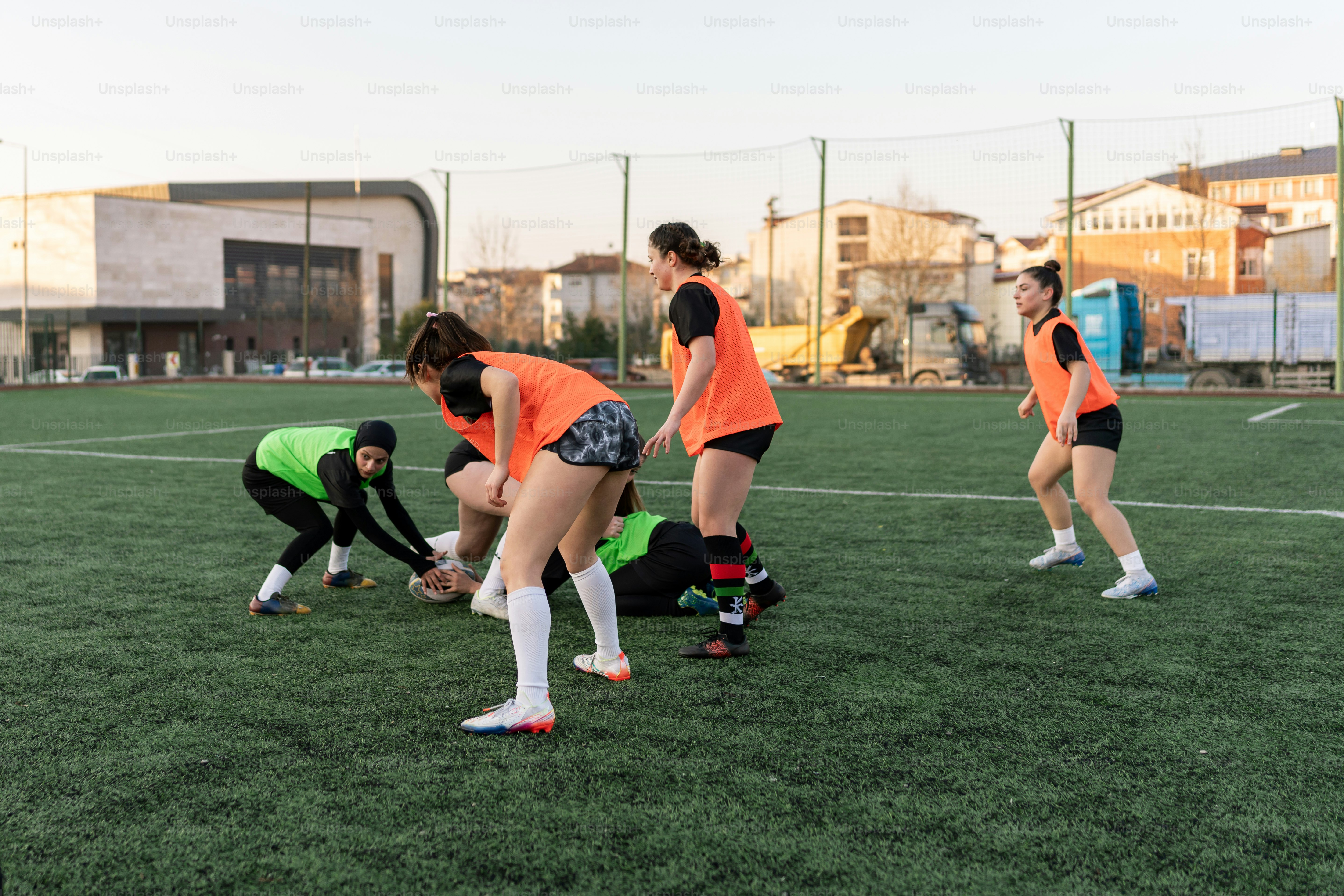 a group of young women playing a game of soccer