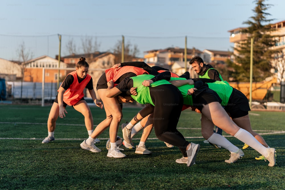 a group of young people playing a game of frisbee