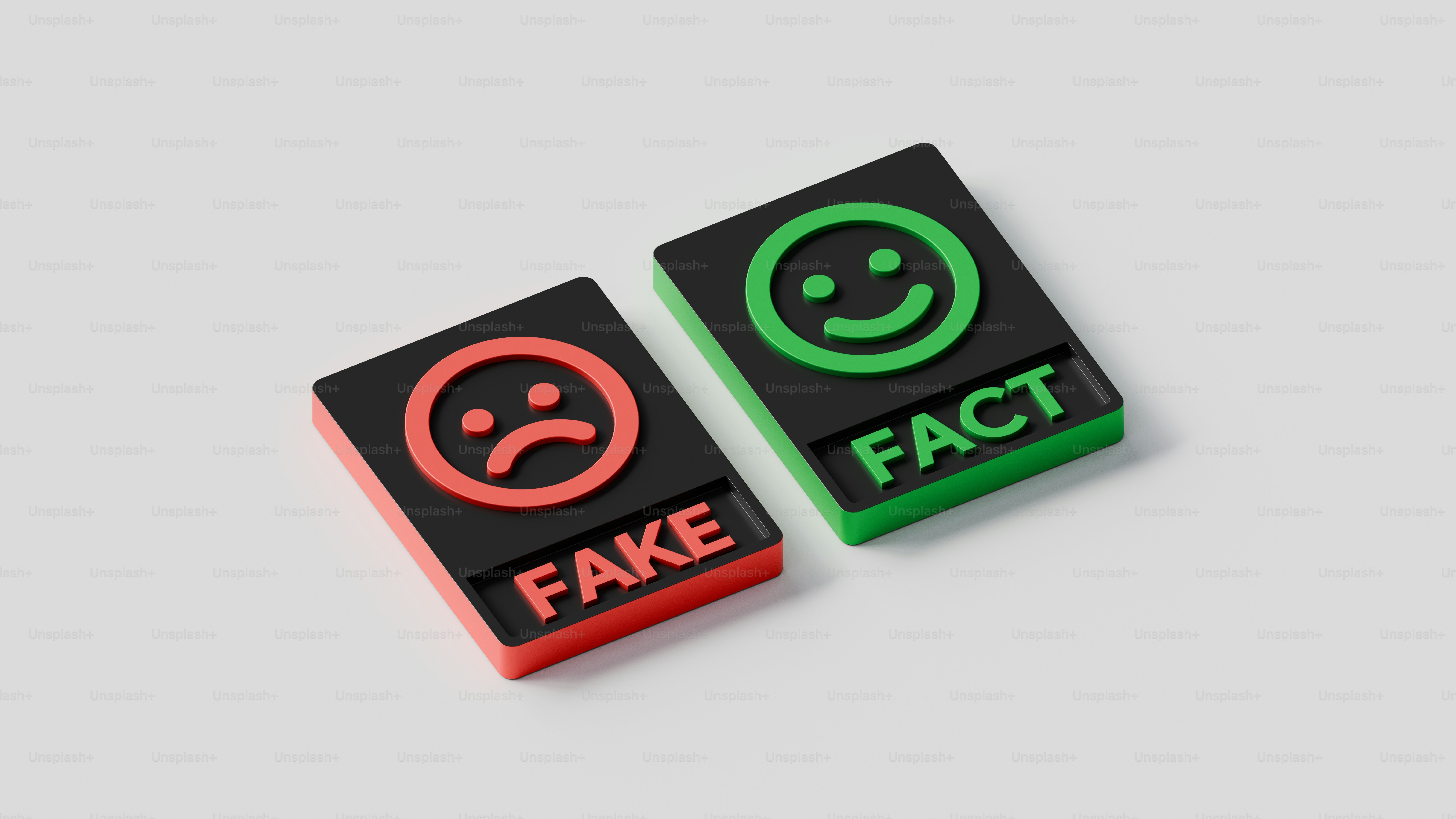 two black and green dices with faces on them