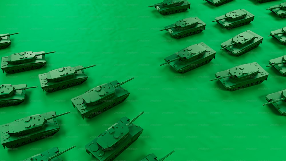 a bunch of tanks that are on a green surface
