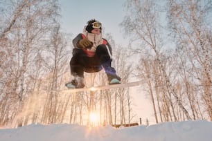 a person on a snowboard jumping in the air