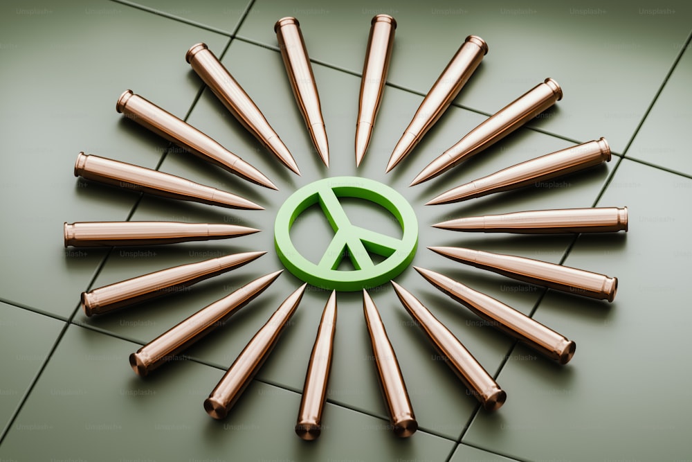 a peace sign made out of copper bullet heads