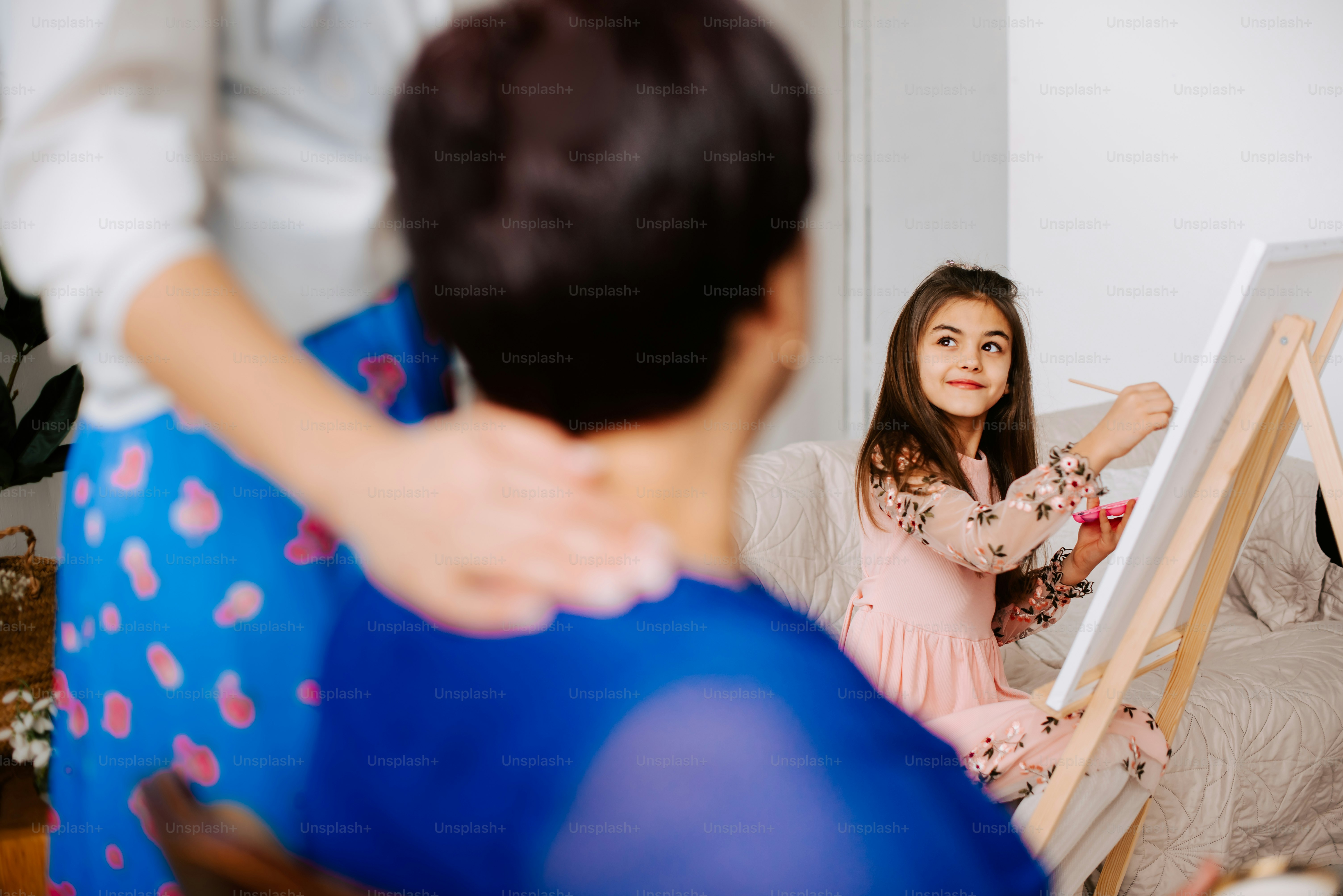 A little girl sitting in front of a easel photo – Grand children Image ...