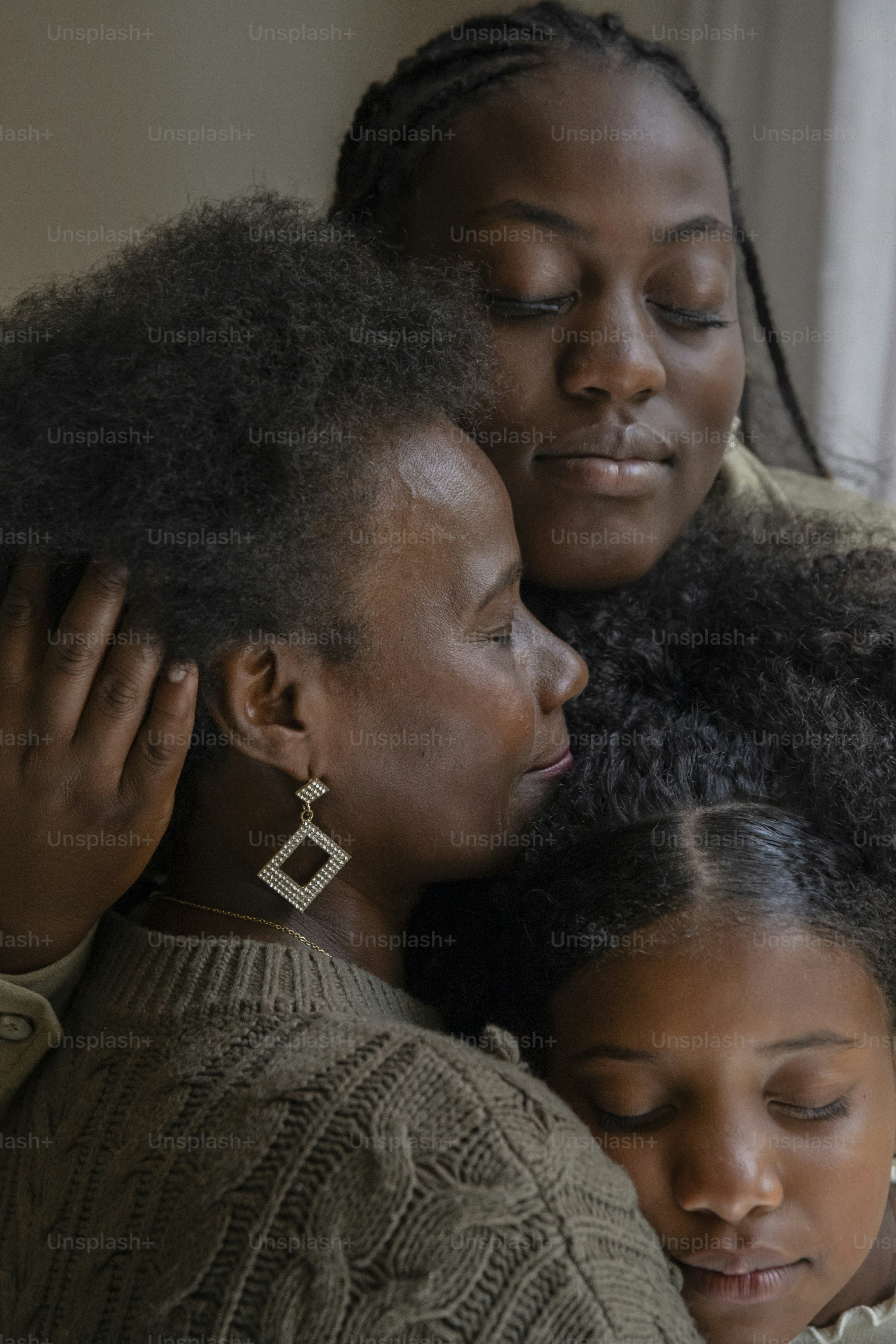 a woman and a girl hugging each other