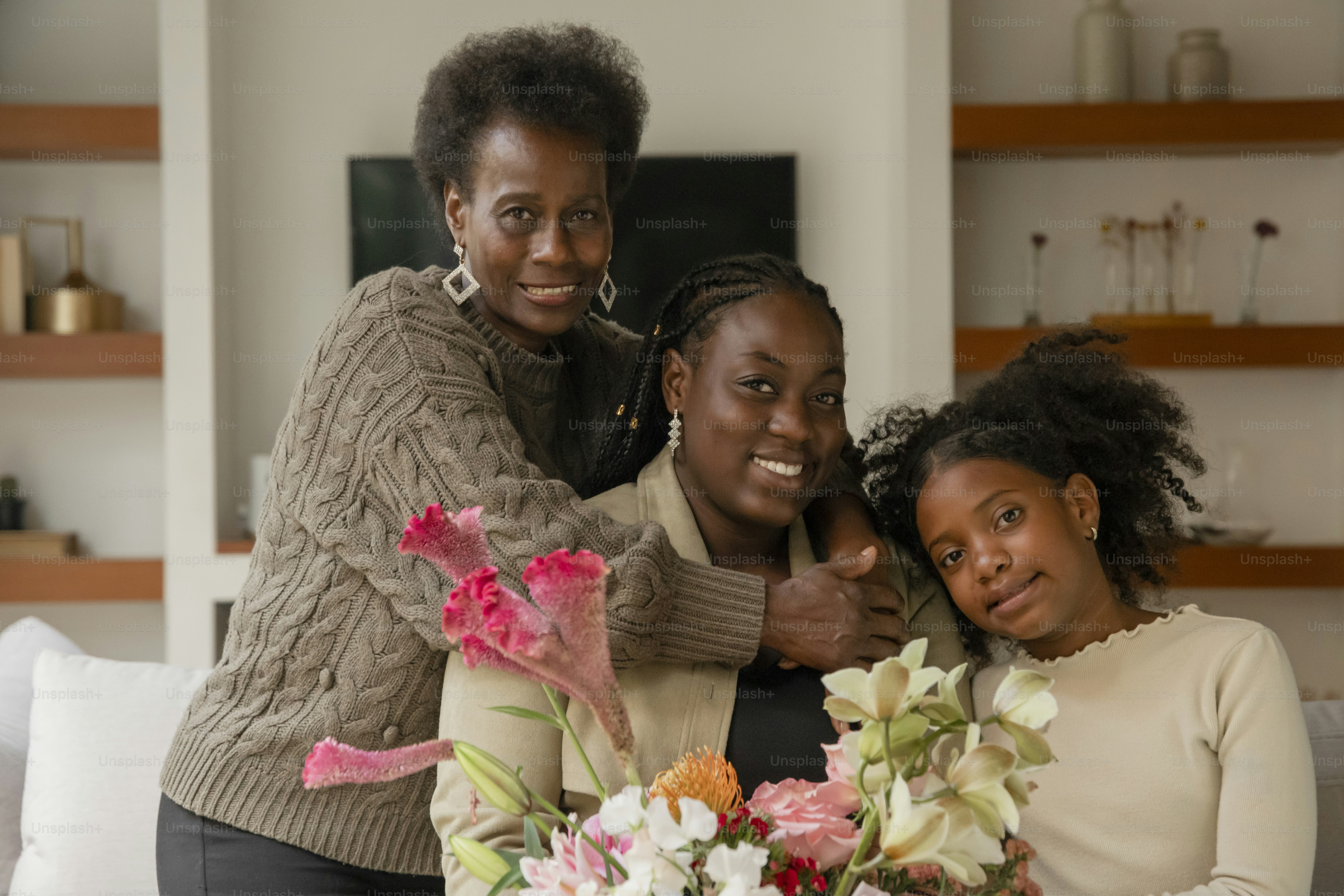 Two women and a girl are posing for a picture photo – Flowers Image on ...