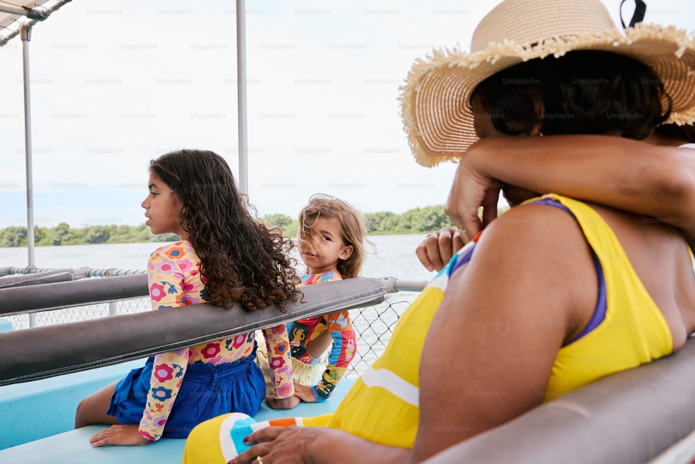 a group of women sitting on top of a boat