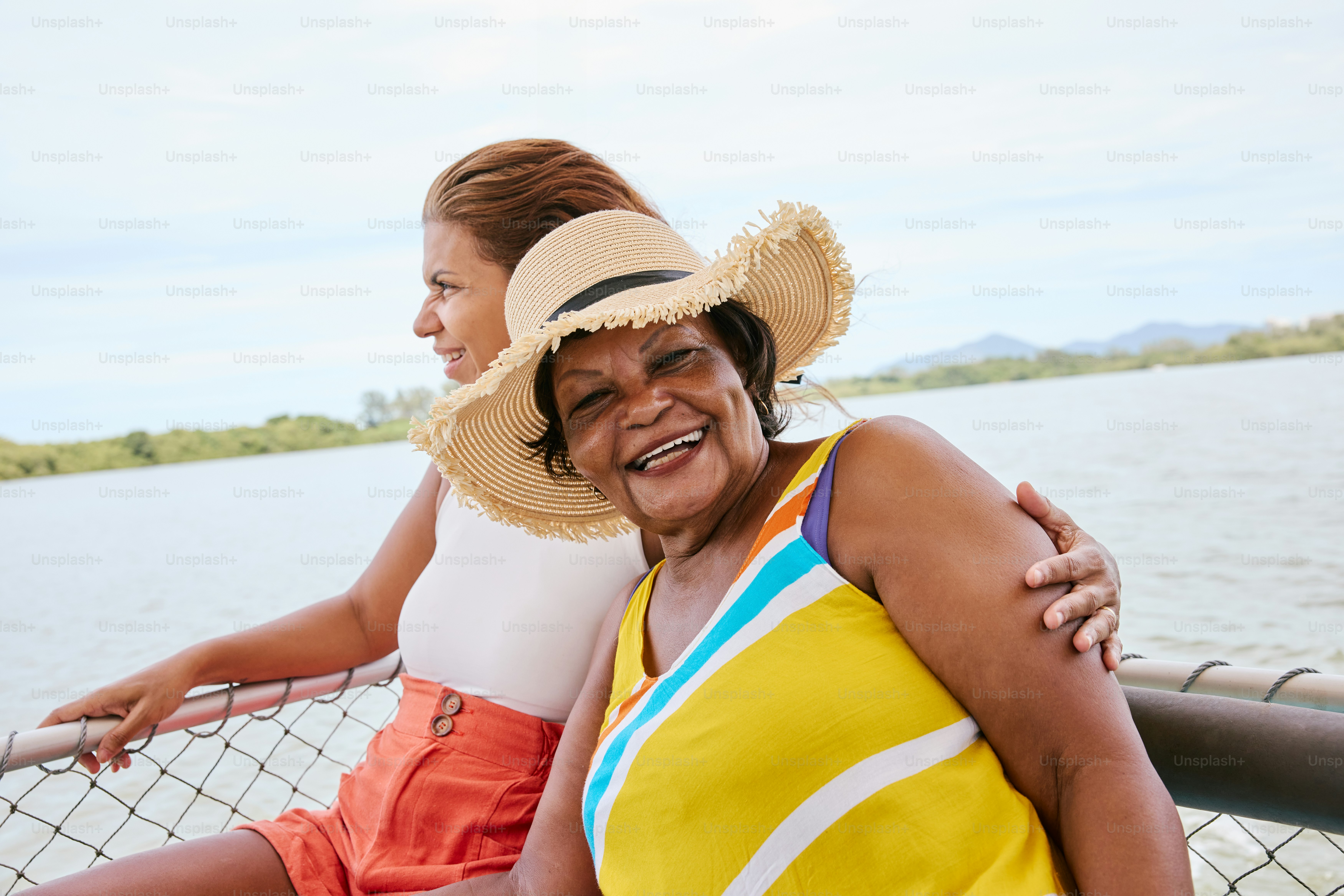 a woman in a yellow top and a woman in a blue and white top are