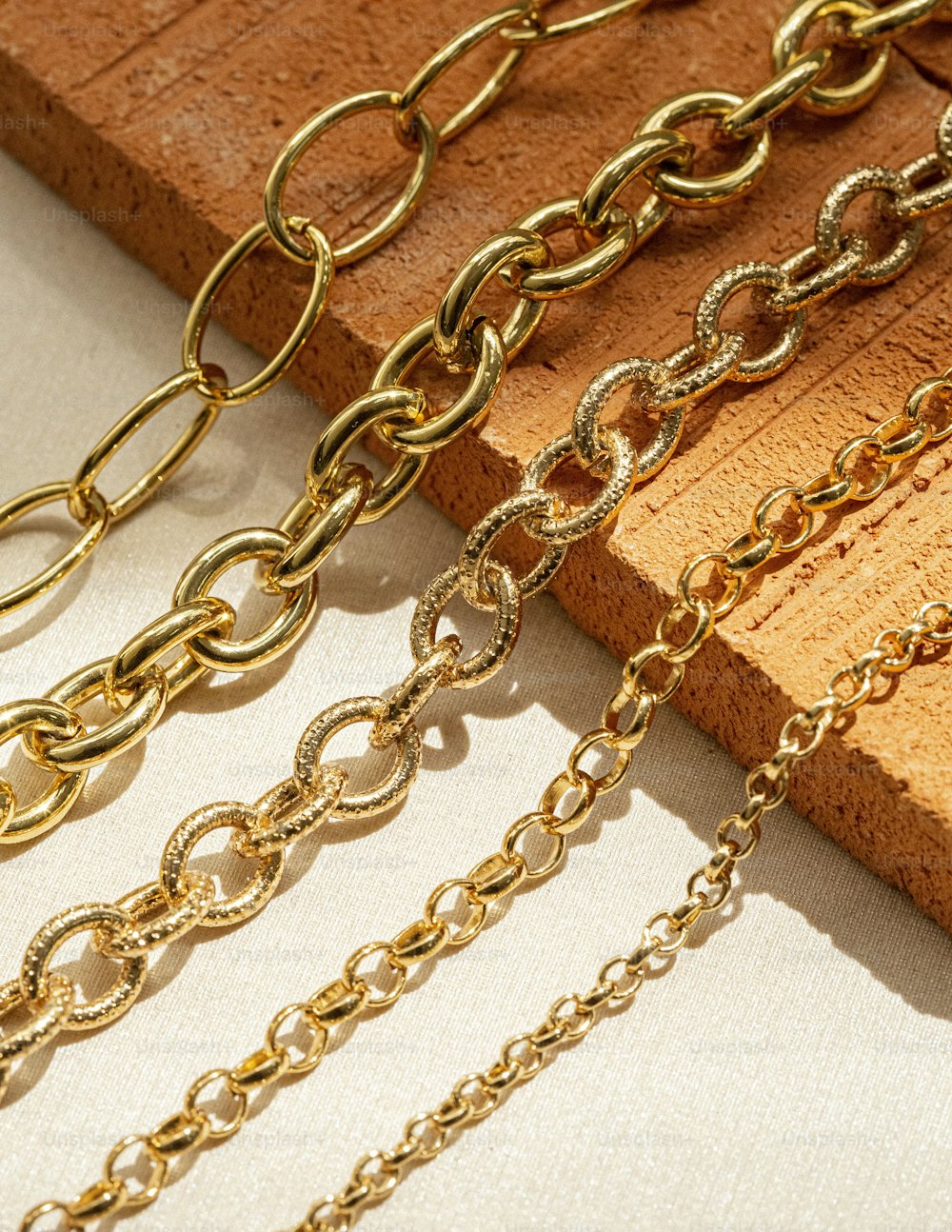 a close up of a number of chains on a table