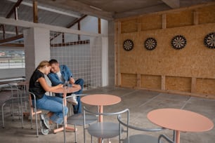 a man and a woman sitting at a table