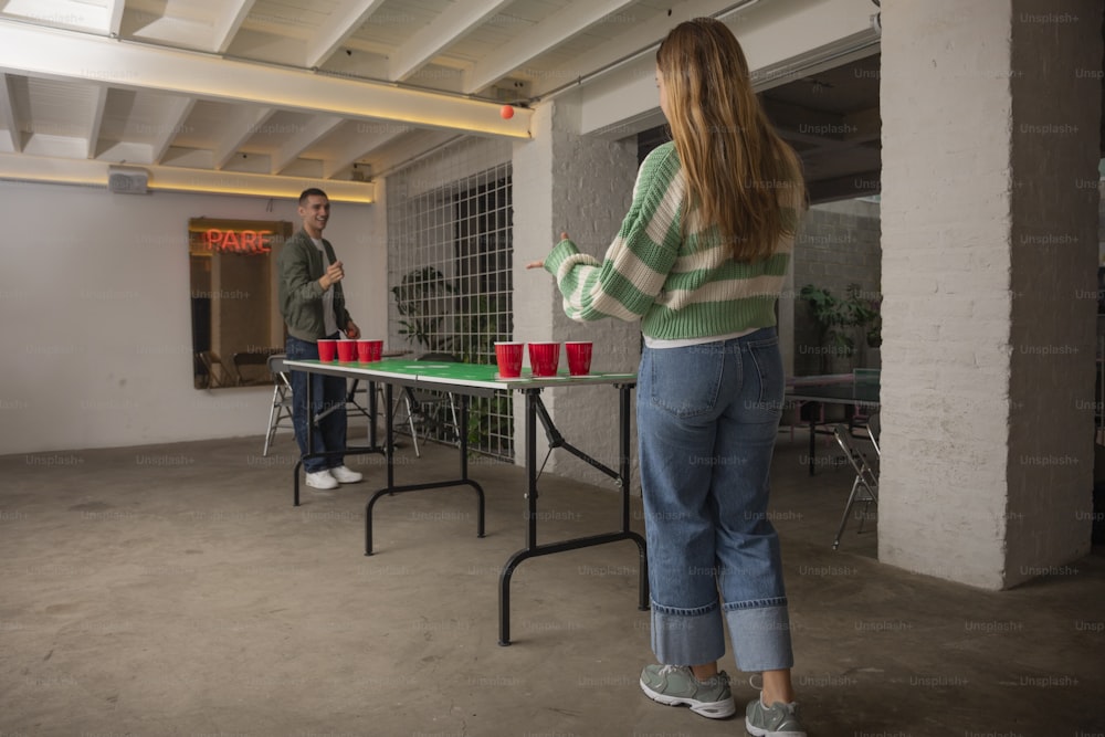 a man and a woman playing a game of frisbee