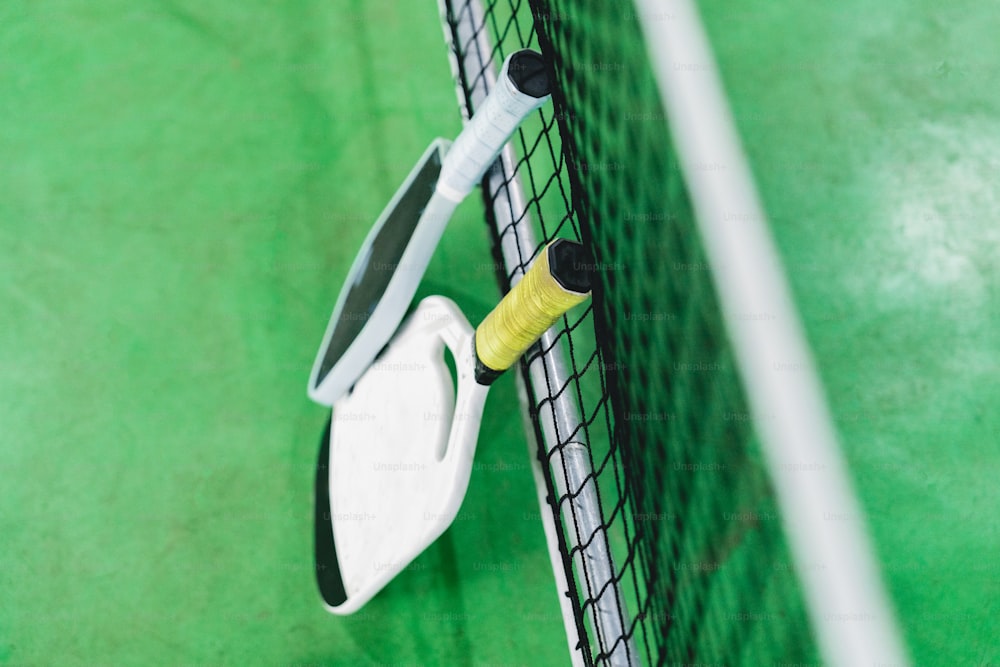 a close up of a tennis racket and a ball