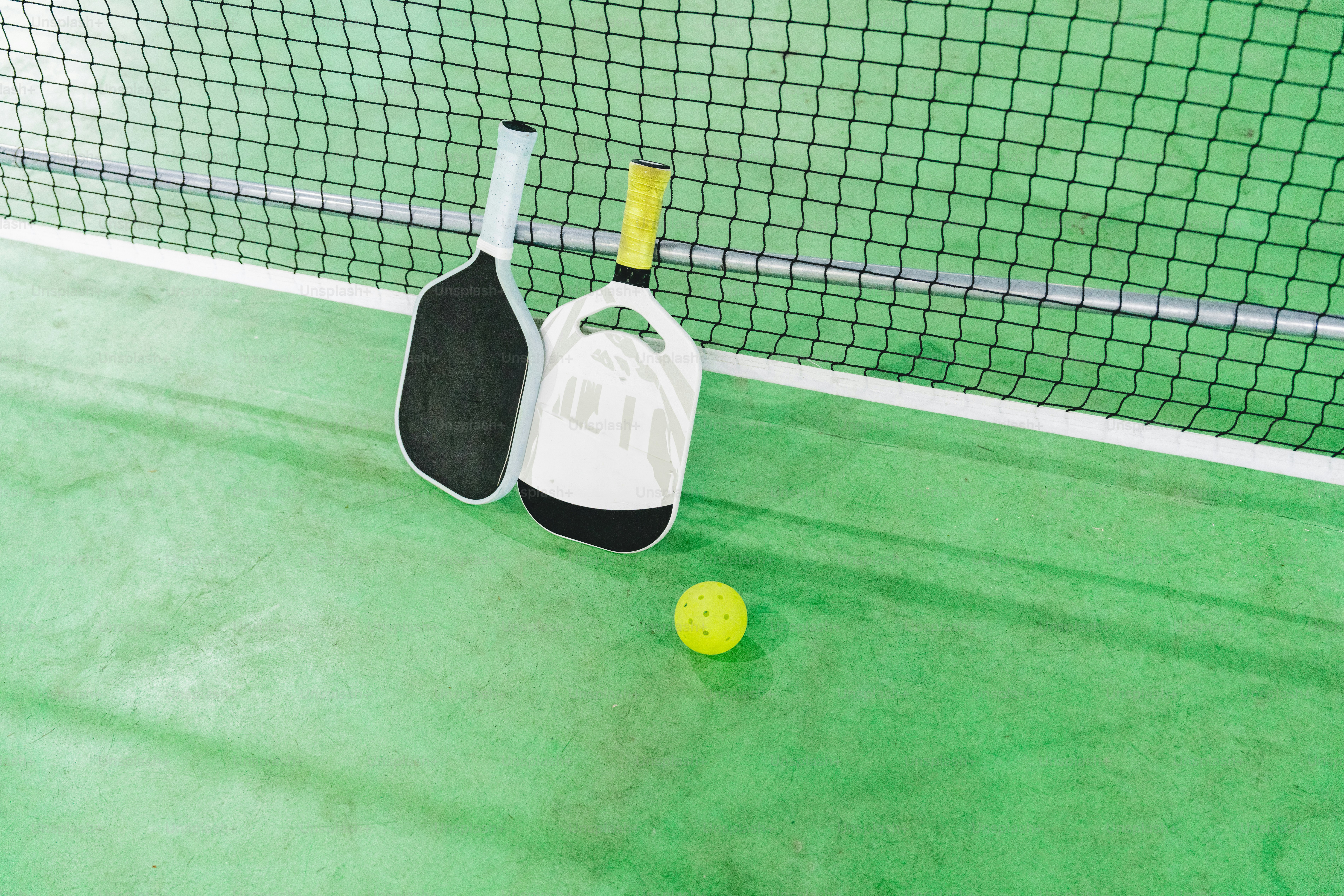 a tennis ball and racket on a court