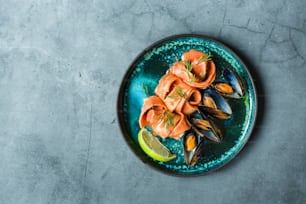 a plate of mussels and shrimp on a table