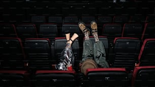 a couple of people that are sitting in a theater