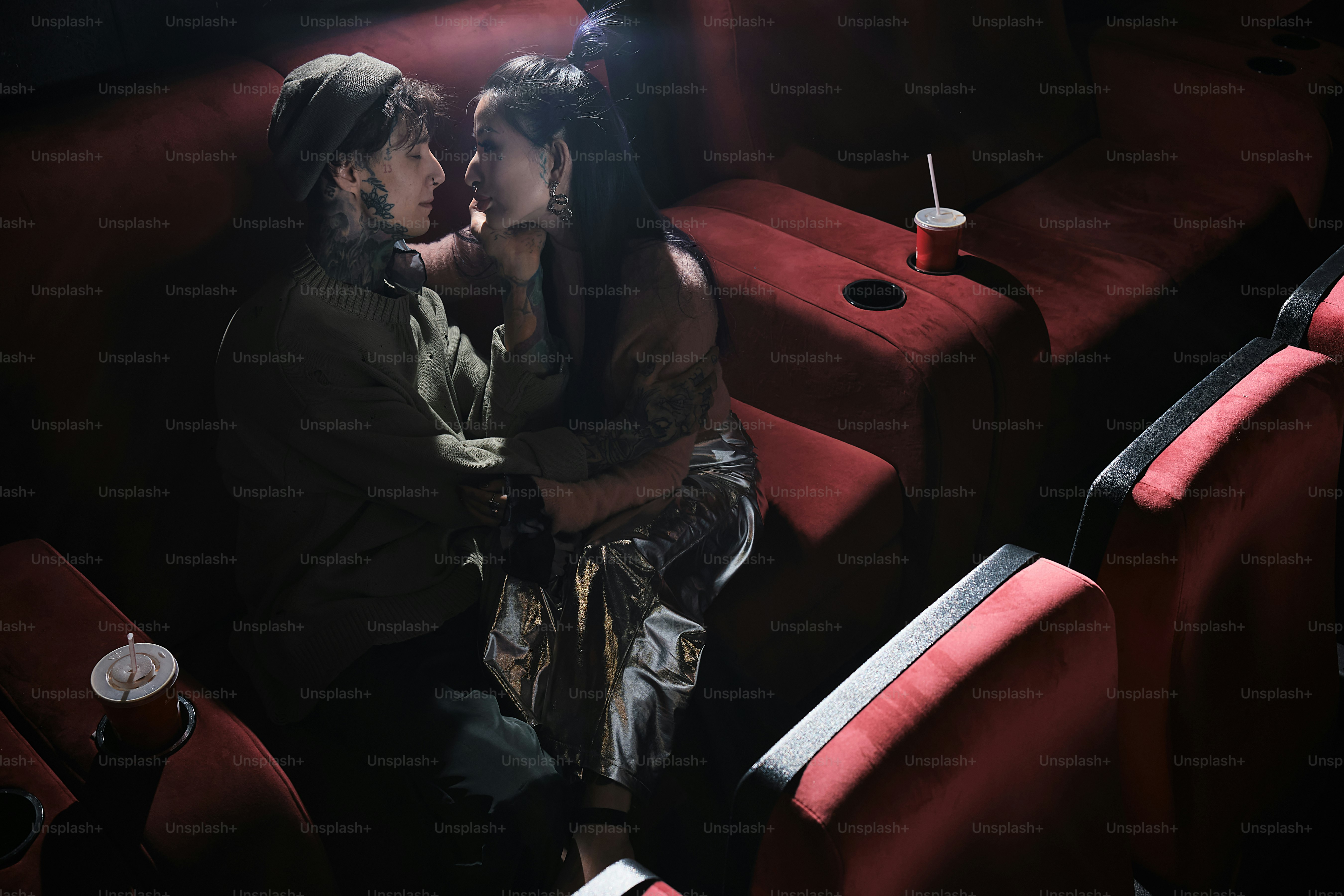 a couple of people that are sitting in a theater