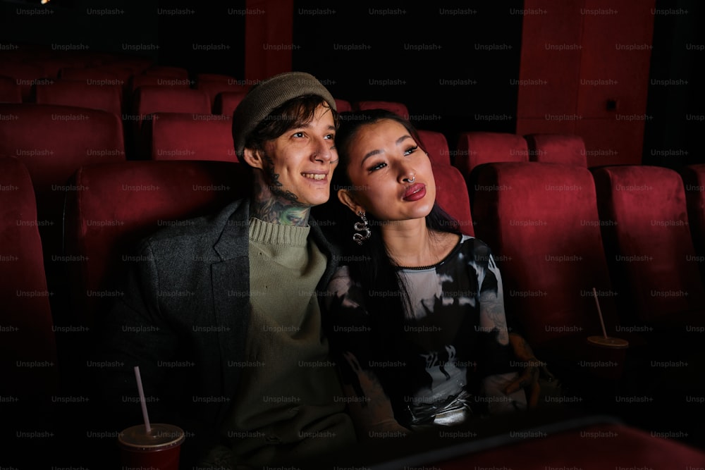 a man and a woman sitting in a theater