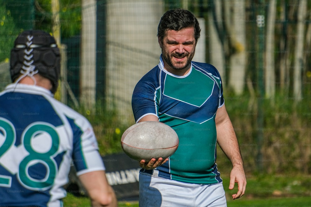 a man holding a football in his right hand