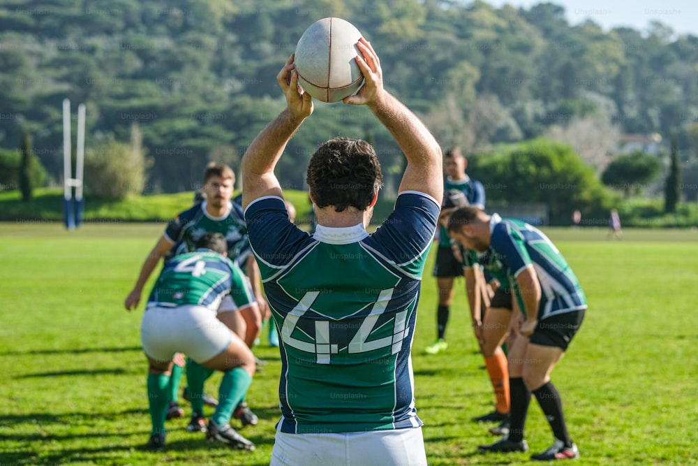 a group of young men playing a game of rugby