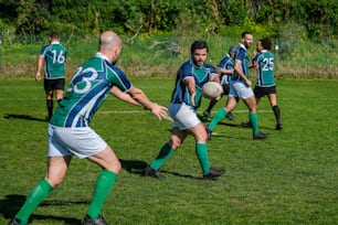 a group of men playing a game of soccer