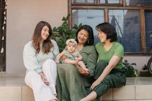 a group of women sitting next to each other