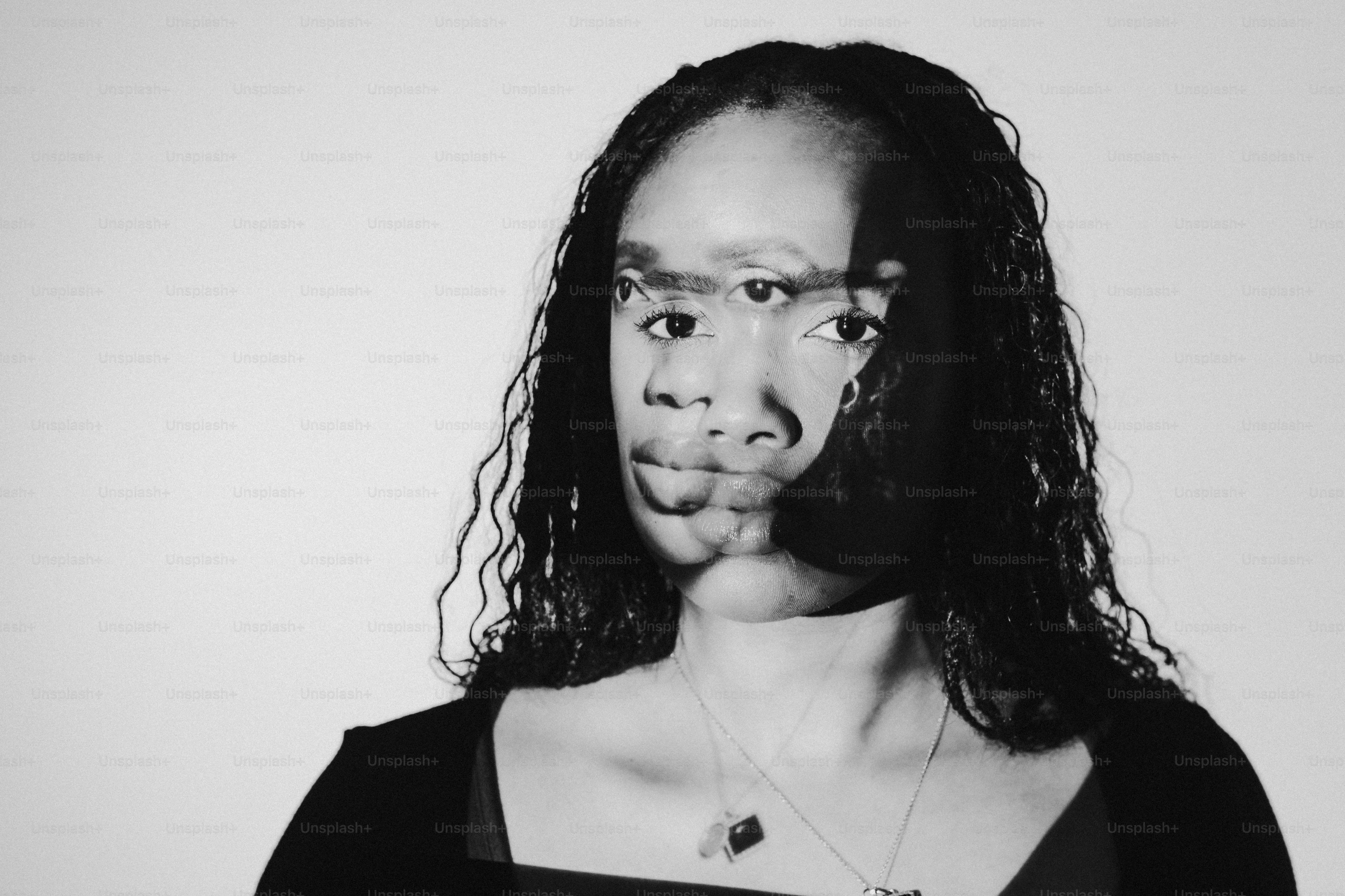 a black and white photo of a woman making a face