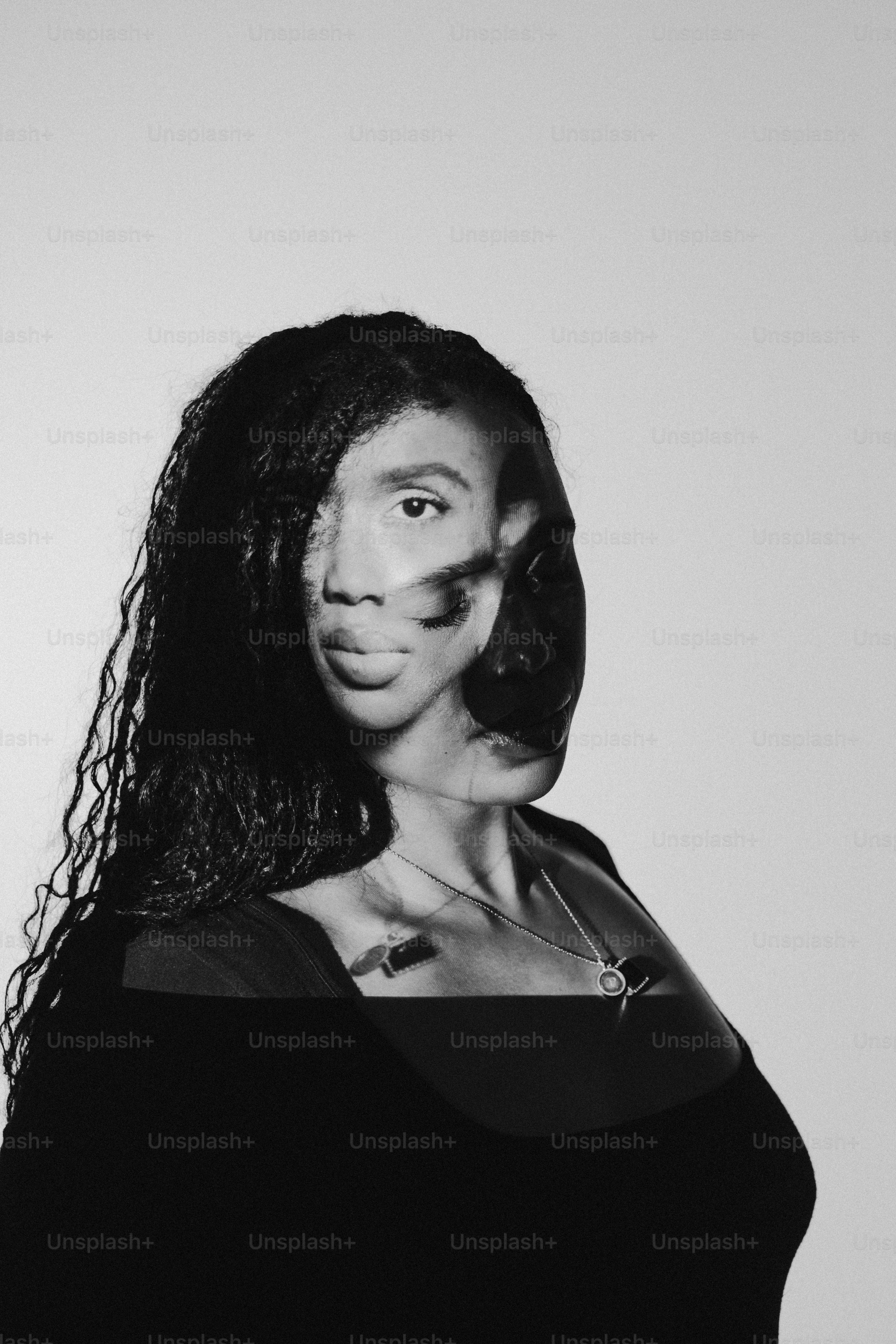a black and white photo of a woman with long hair