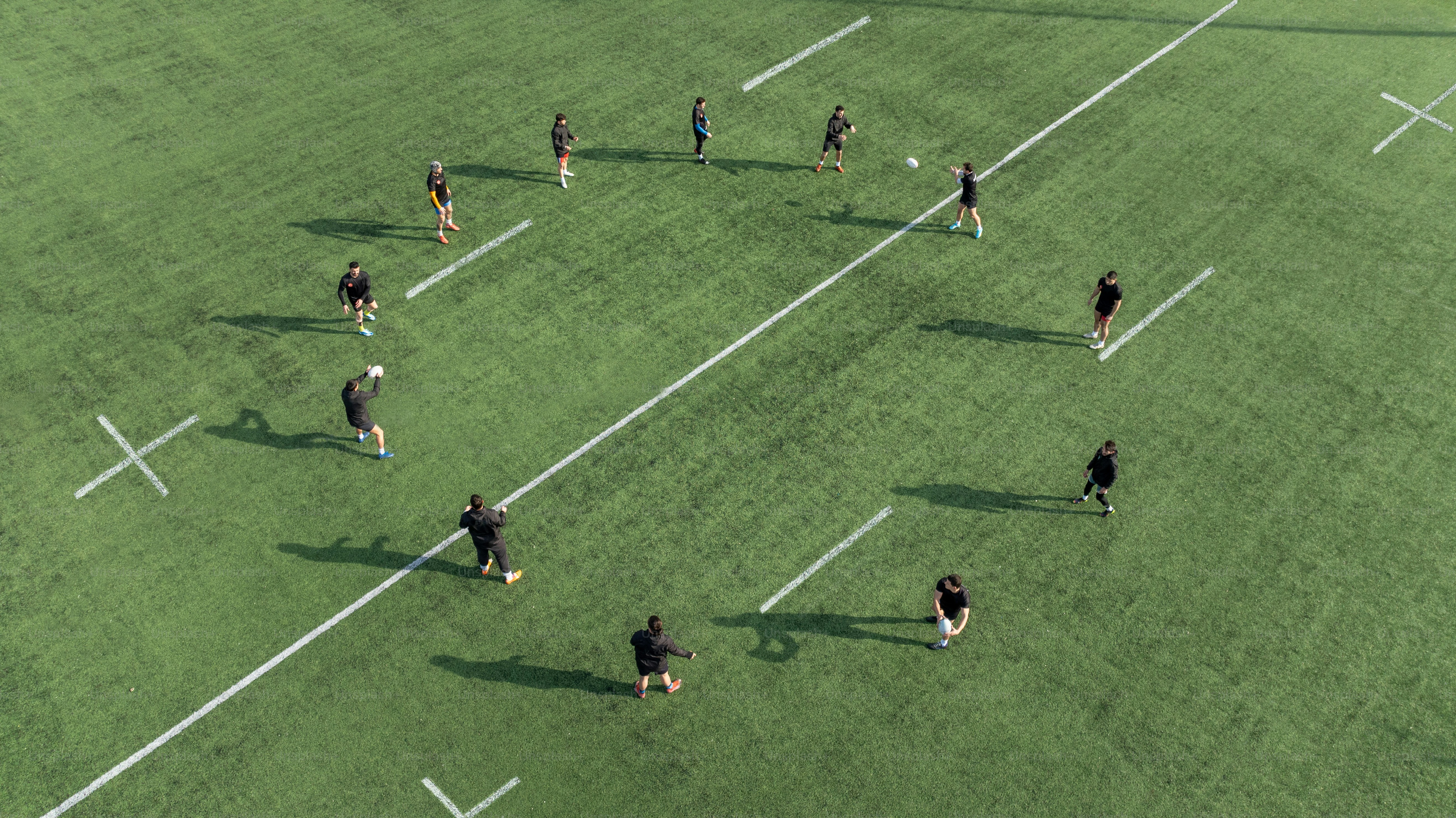 A group of people playing a game of frisbee photo – Rugby Image on Unsplash