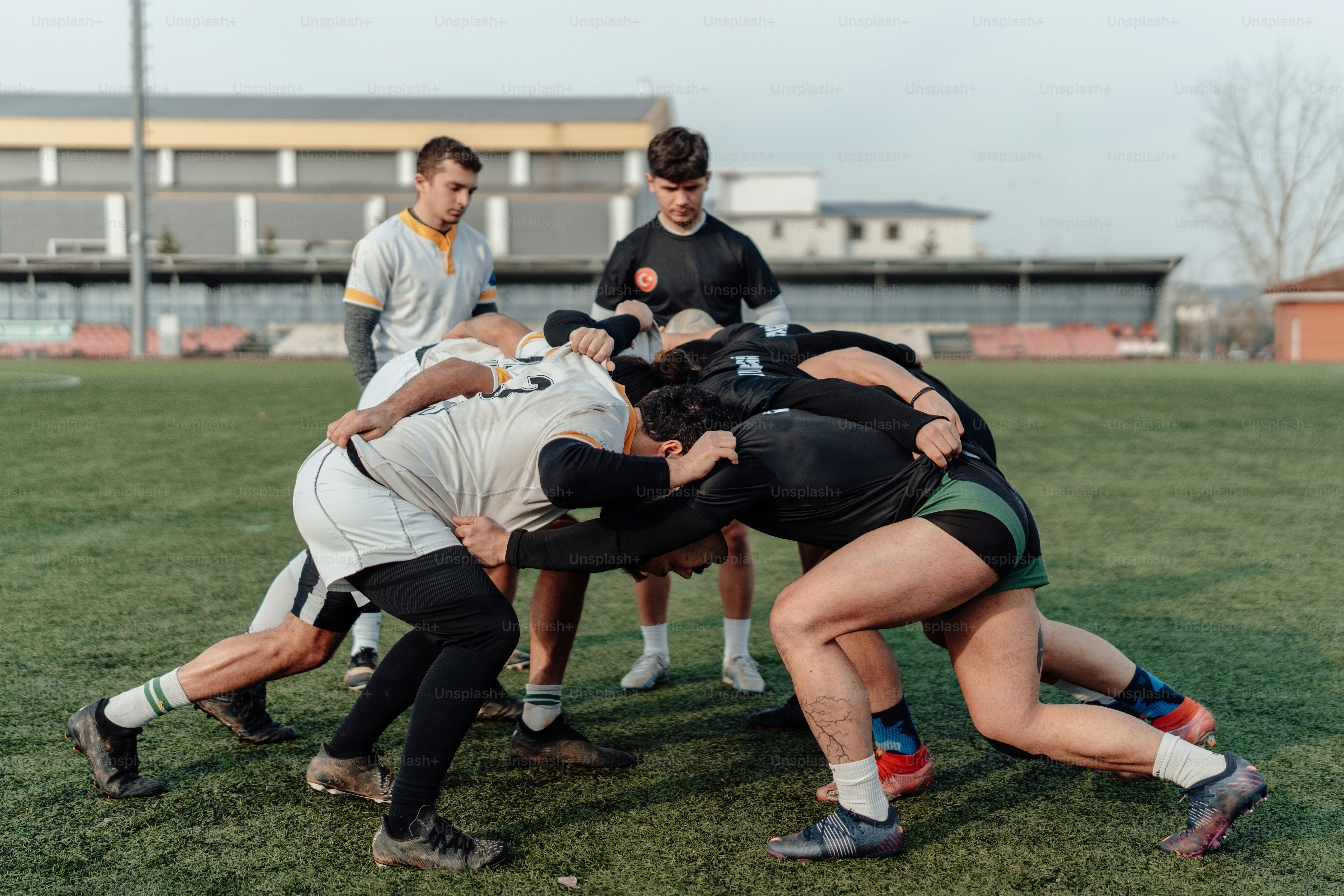 A group of young men playing a game of frisbee photo – Rugby Image on ...