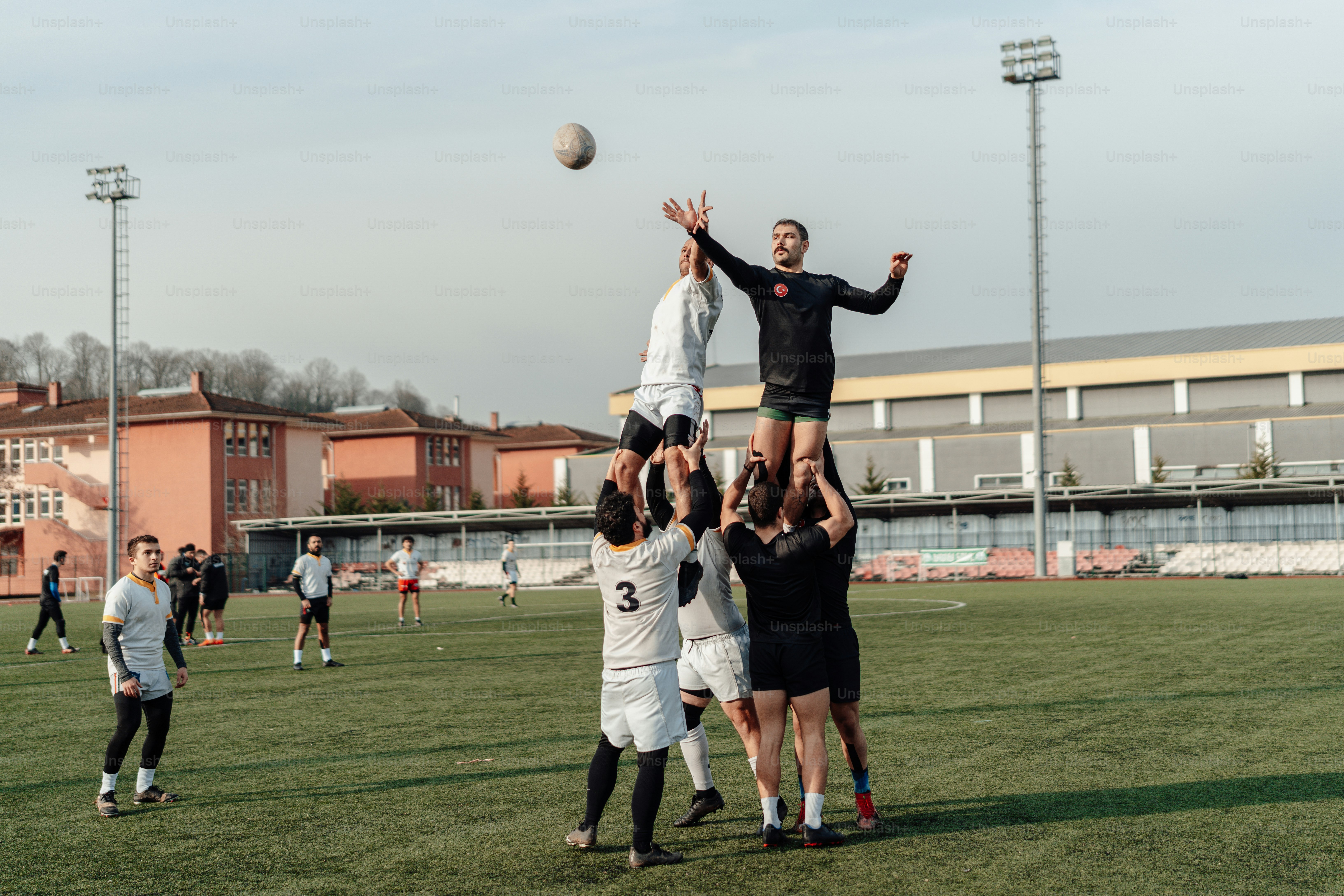 A group of people playing a game of frisbee photo – Rugby Image on Unsplash
