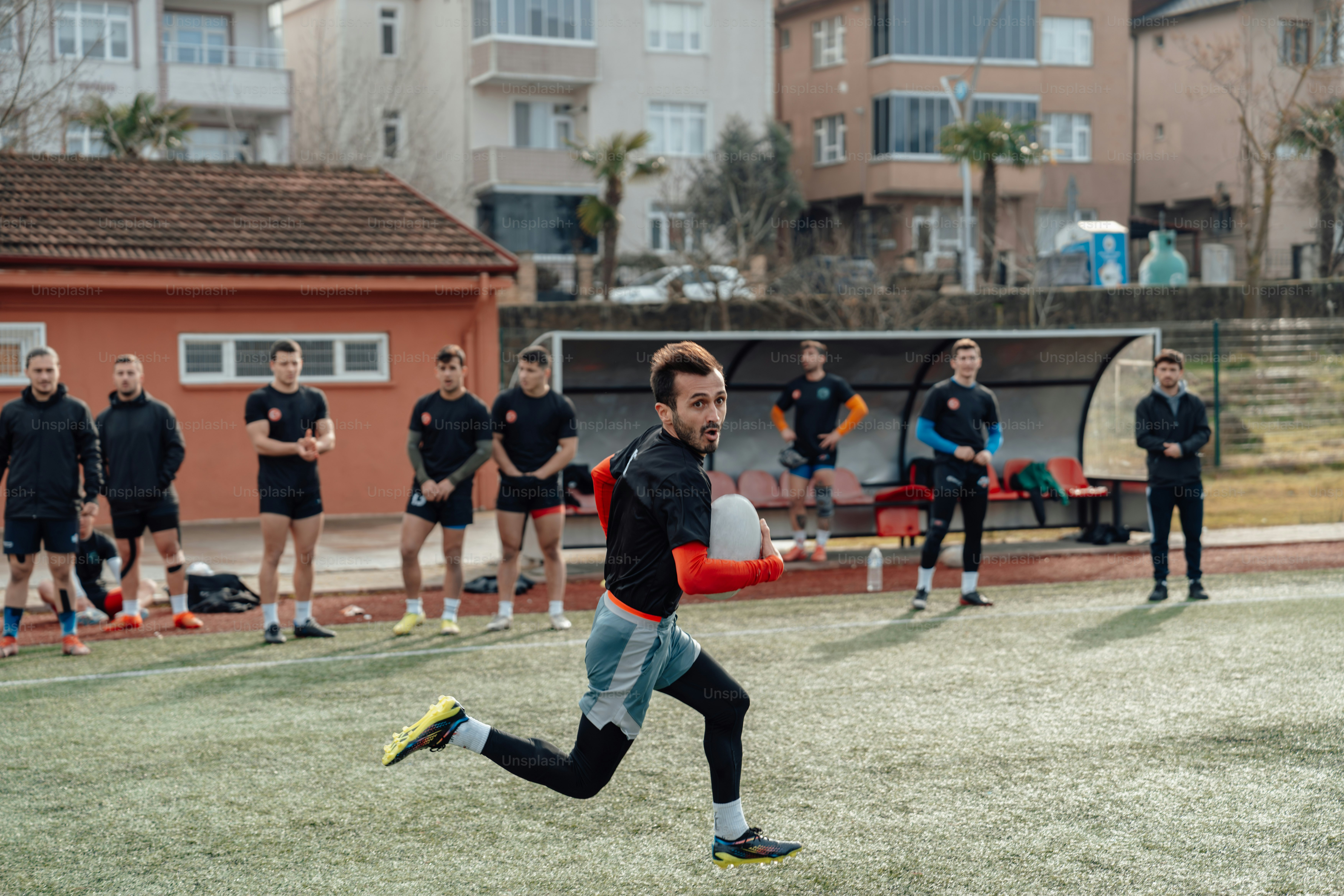 a group of men playing a game of frisbee