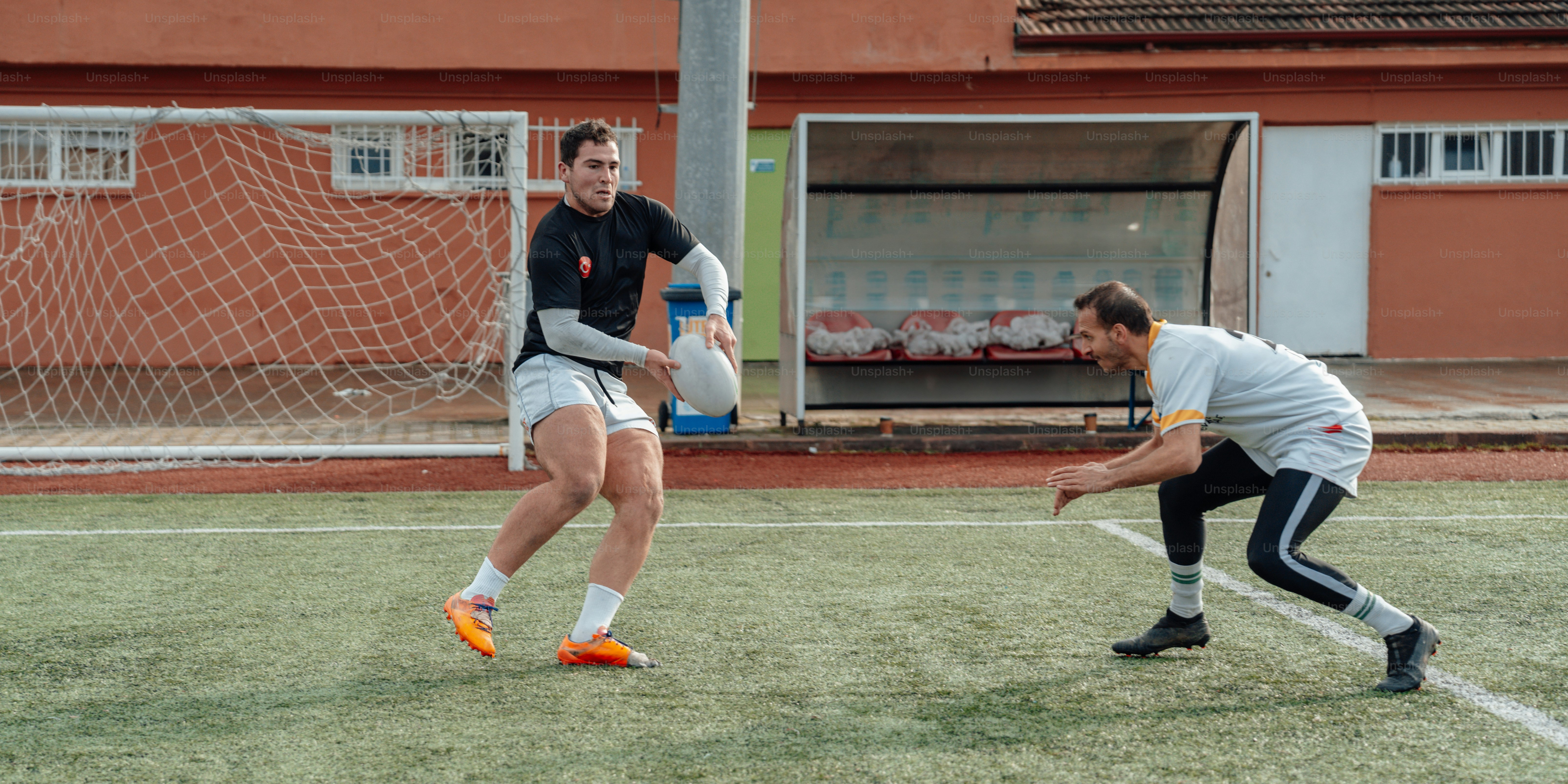 a couple of men playing a game of soccer
