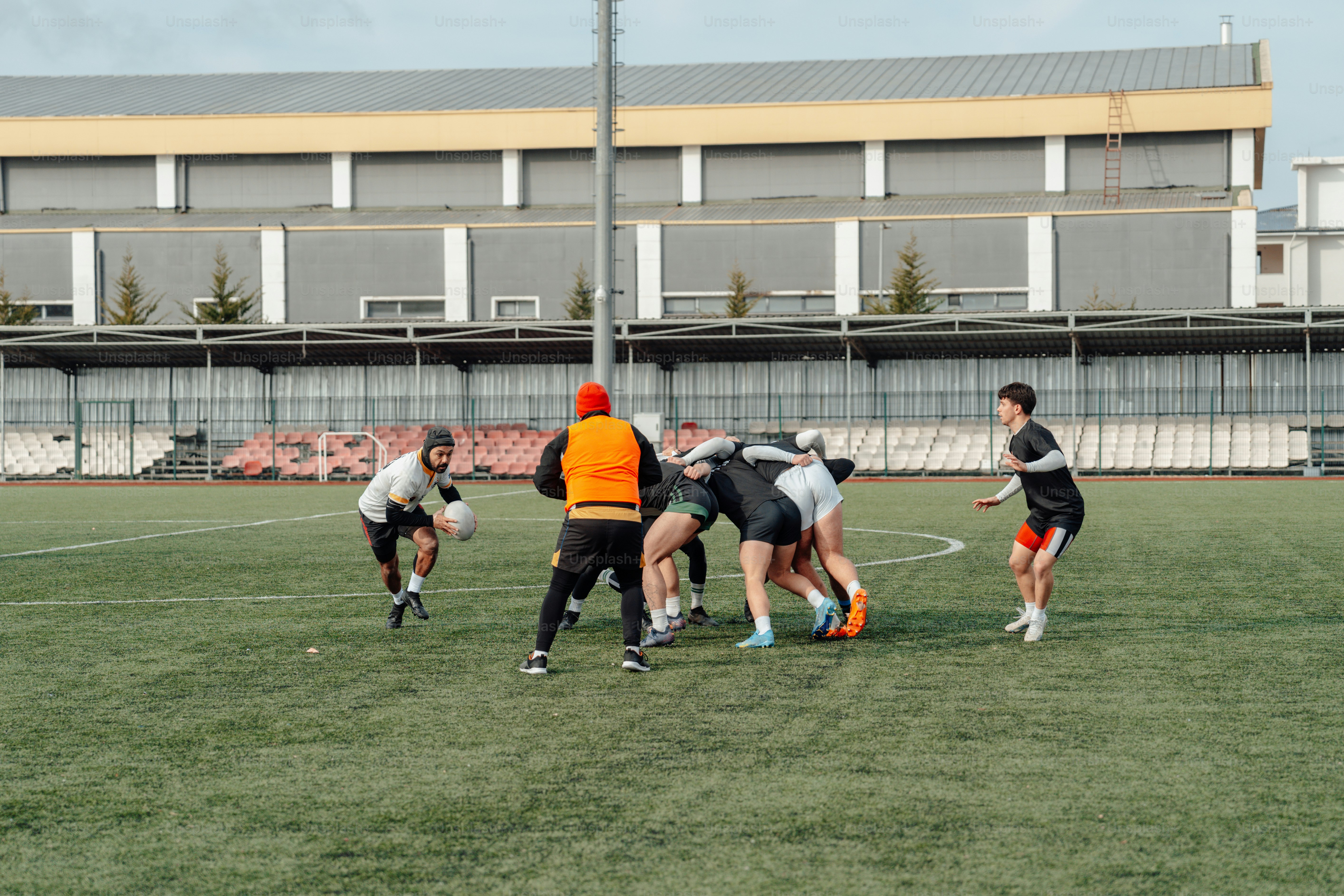 a group of people playing a game of frisbee