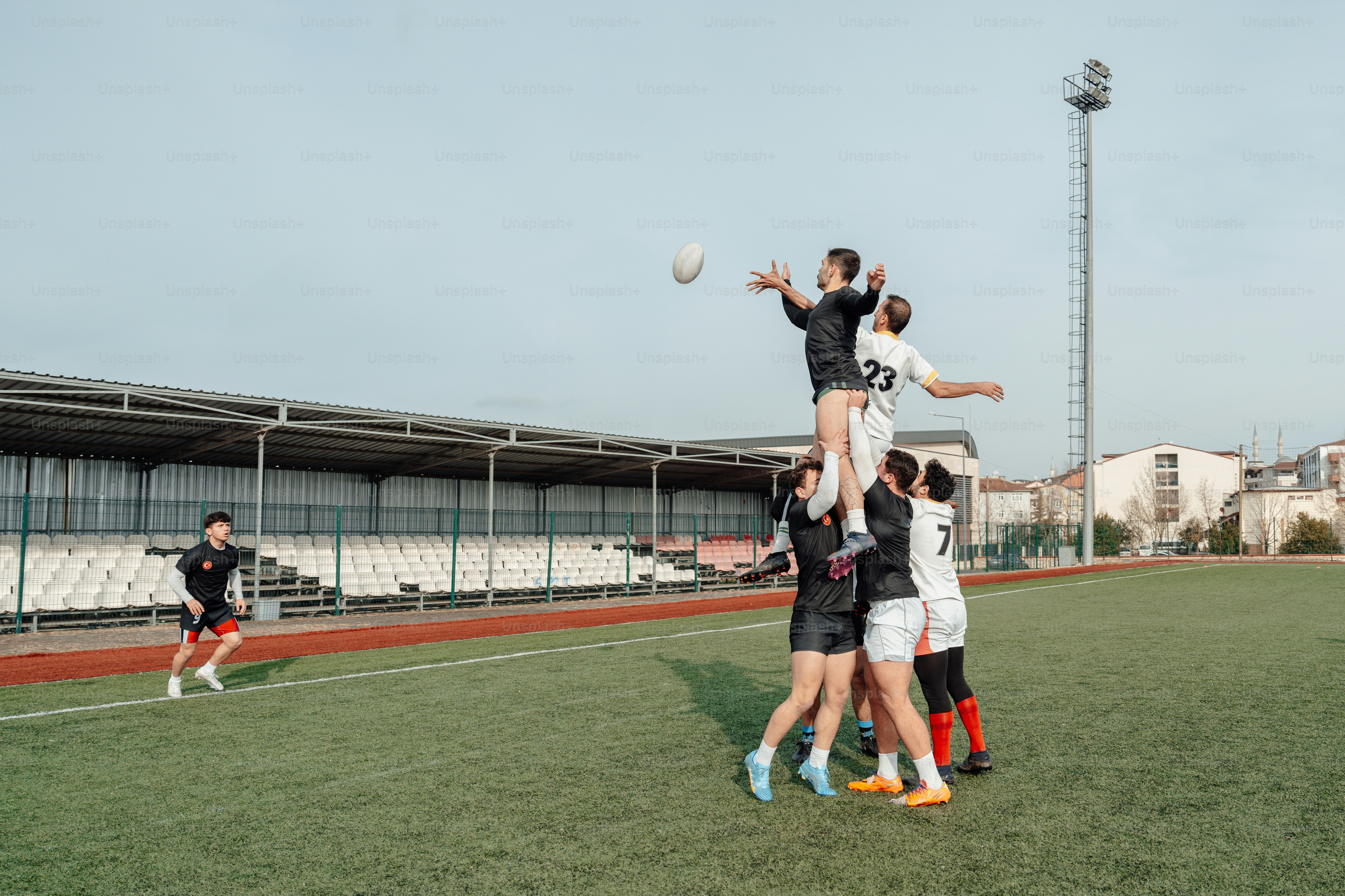 a group of young men playing a game of soccer