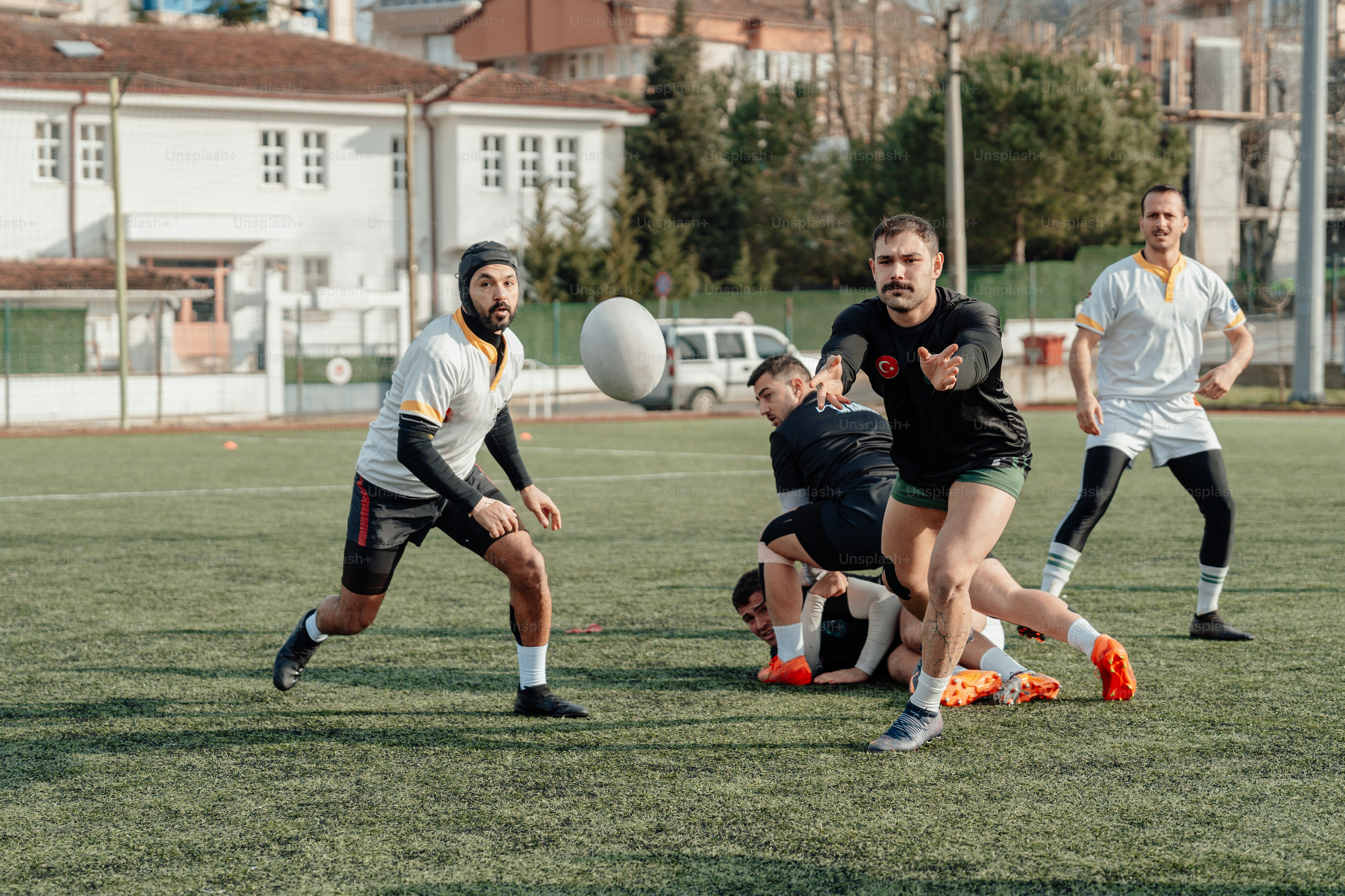 a group of men playing a game of soccer