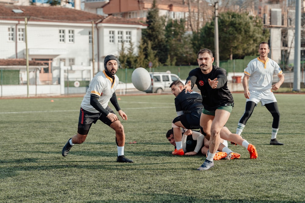 a group of men playing a game of soccer