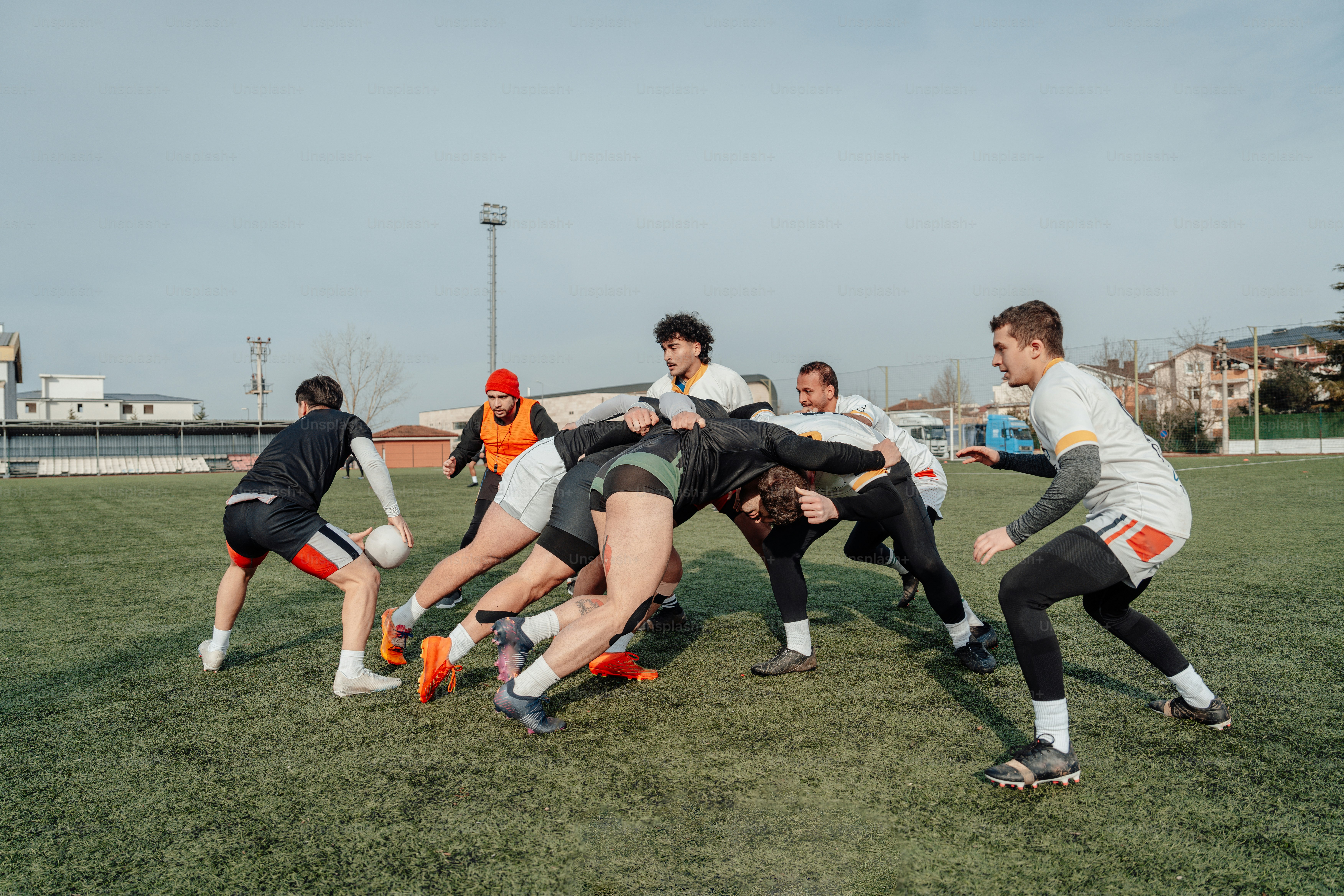 a group of young men playing a game of frisbee